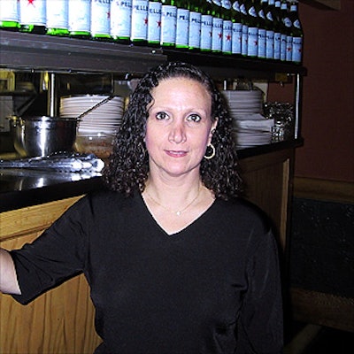 Marianne DeLuca, one of the managers at Goodfellas Trattoria & Pizzeria, watched over the wait staff serving food donated by the restaurant.