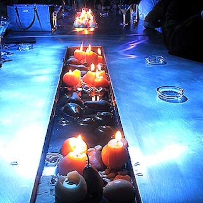 Water-inspired decor complemented Wet's name: The Strategic Group filled troughs in stainless steel tables with water, candles and pears—to represent the flavor infused into Wet.