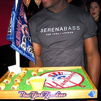 Mini hot dogs on wooden trays lined with green pebbles gave a nod to the Yankees' baseball dynasty.