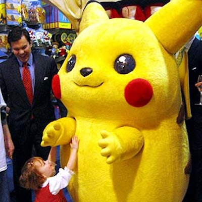 A guest at the Society of Memorial Sloan-Kettering Cancer Center's Bunny Hop couldn't keep away from an actor dressed as Pikachu.