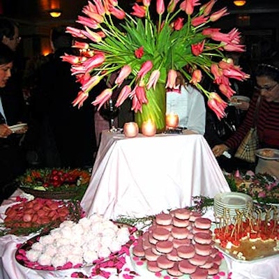 Guests were offered a variety of buffet of pink foods decorated with a vase full of pink tulips from Michael George at Elegant Bride's Market Week party at Cafe St. Bart's.