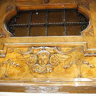 An intricate marble archway discovered underneath sheetrock in the midst of the venue's restoration process decorates the ladies' room.