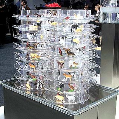 Catering firm Lettice used plastic toys in place of food to show off its method of stacking plates with wide plastic tubes between them so guests can grab food quickly at a party.