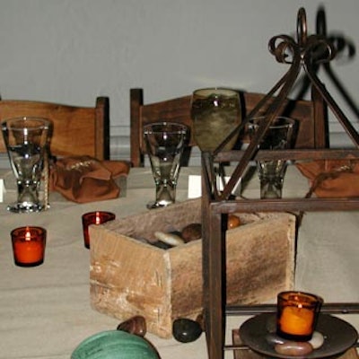 Lanterns and pieces of pottery filled with grains served as centerpieces, flanked with votive candles and dishes of olives, dried fruits and nuts.