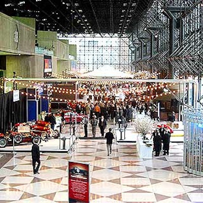 Lights hanging in the north lobby area of the Javits Center helped bring a block party feel to the Auto Show preview benefit for the East Side House Settlement sponsored by Grupo Ferrari Maserati.
