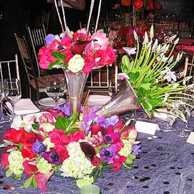 Renny Reynolds of Renny's Designs for Entertaining incorporated silver bell-shaped vases into his arrangement.