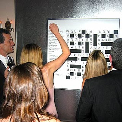 A giant magnetic crossword puzzle gave guests something to do, while symbolizing the idea that information—Bloomberg's product—solves problems.