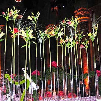 Lilies appeared to float in thin air with Les Marrons' slender plastic tube stem receptacles that decorated the event's bar.