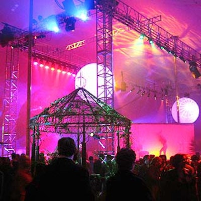 Starr Tents' party tent featured rigging in the center for lights and two weather balloons. Shadowdancers performed on a platform surrounded by stretch fabric in the center of the tent.