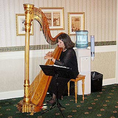 A harpist played for guests as they got off the elevator to enter the party.