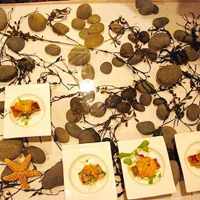Rocks, starfish and dried kelp underneath a sheet of Plexiglas decorated Trey Foshee of George's on the Cove's table. The San Diego chef served sea urchin bruschetta with a marinated onion salad.