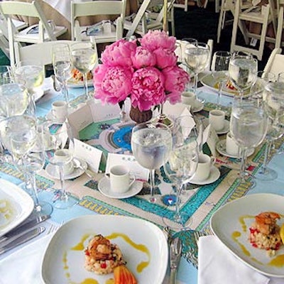 A special scarf designed by event sponsor Hermes commemorating Central Park's 150th anniversary covered the center of each table beneath the floral centerpieces by Andrew Pascoe Flowers.