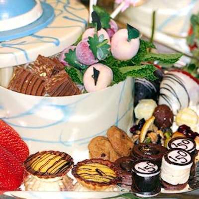 Abigail Kirsch Culinary Productions created chocolate hat boxes filled tarts, cookies and truffles for dessert. (Photo by Stillman Jefferson Thomas Digital Photography)