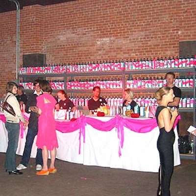 Bombay Sapphire doled out drinks in front of a big wall branded with the company's bottles wrapped in pink campaign ribbons.