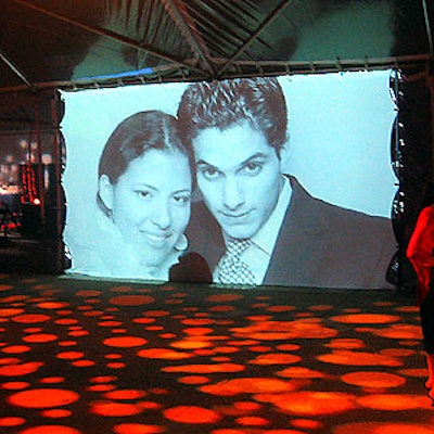 The portraits were projected on a giant screen on one wall of a tent.