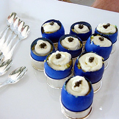 Eggshells dyed blue were filled with whipped eggs and creme fraiche, and topped with caviar.