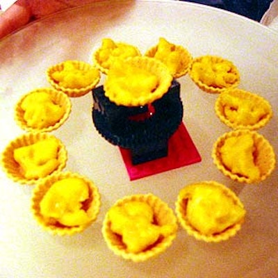 Thomas Preti Caterers served macaroni and cheese tartlets on serving trays decorated with small Lego sculptures.