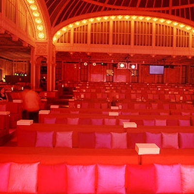For the awards ceremony, Isabell created a supper club-style seating area with rows of banquettes topped with hot pink silk cushions.