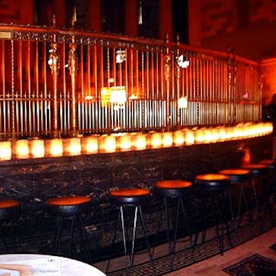 Gotham Hall was simply decorated with candles in glass jars wrapped in gold organza sleeves.