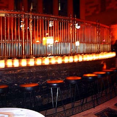 Gotham Hall was simply decorated with candles in glass jars wrapped in gold organza sleeves.