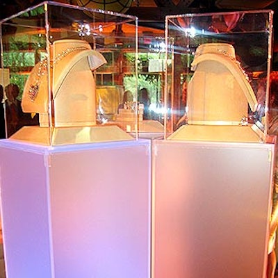 Frosted white Lucite towers from Design Compendium underlit with color-changing lights displayed the new jewelry collection.