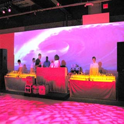 Eyemag projected a video of a crashing wave—calling to mind a surfing scene in the movie—behind DJ Beverly Bond's booth.