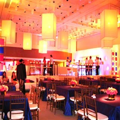 For the Legally Blonde 2 premiere party, Wendy Creed transformed the James Christie Room into a bilevel V.I.P. room. The lower level featured white walls with circular cutouts backlit with pastel lights, and tables covered with purple dupioni silk cloths and small pink floral arrangements filled the center of the room.