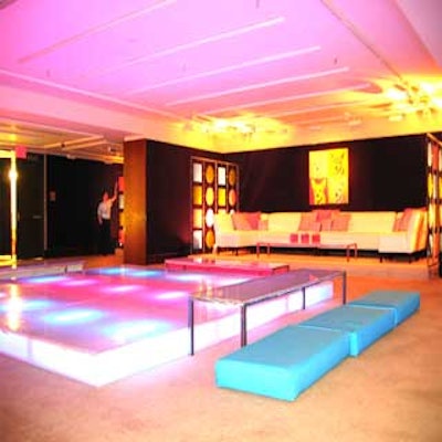 An Andy Warhol-esque painting of Bruiser, the canine star of the film, was the backdrop for a small lounge area that overlooked an illuminated dance floor.