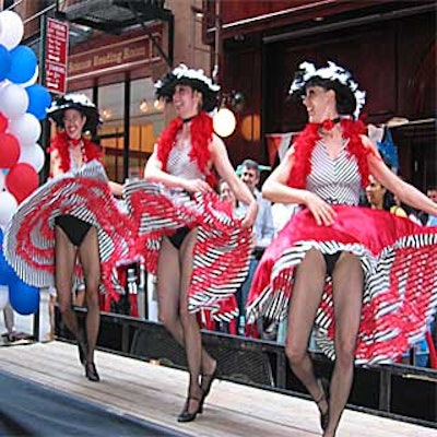 Cancan dancers performed on a small portable stage for Les Halles's Liberty Festival on John Street.