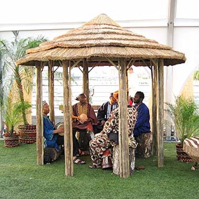 A group of African drummers played inside one of the huts.