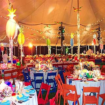 Robert Wilson and designer Susan Miller Smith created a festive Cuban atmosphere with twinkly lights, painted plywood pineapples and plastic parrots for the Watermill Center's Molino Cubano benefit.