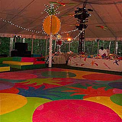 Artists-in-residence at the Watermill Center painted the dance floor with bright, multi-colored pineapples.