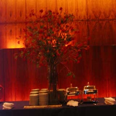 A large, red floral arrangement decorated a buffet table.