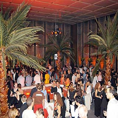 Guests mingled around the pool of water and palm trees in the the Pool Room. (Photo by Patrick McMullan)