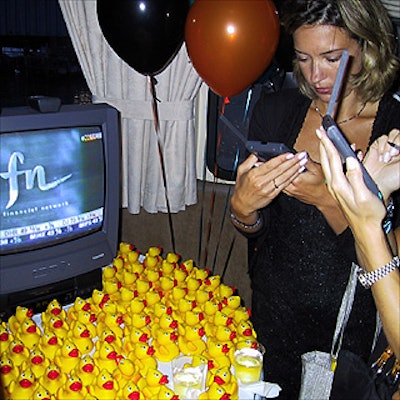 Guests tried out Kstrat's 'Omnitailing' concept on Palm Pilots and received rubber duckies from Minicucci & Williams.