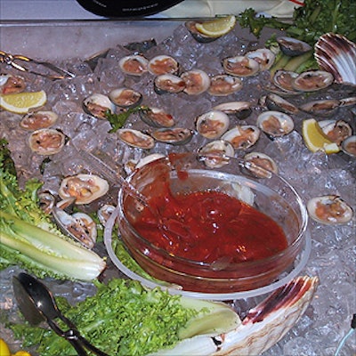 A raw bar with oysters and shrimp from Elaine's Catering fed guests at Kstrat's summer cruise aboard Mystique, a cruise ship booked through Metropolitan Yacht Charters.