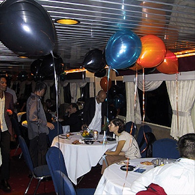 Teal, orange and black balloons from Balloons to Go floated throughout the boat as guests danced and mingled.