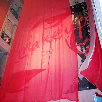 For the launch party of Diane von Furstenberg's makeup line at Henri Bendel, Bendel visual director Gilbert Vanderweide suspended sheer red fabric with the 'DVF' logo and a giant banner of the cosmetic line's logo from the top floor.