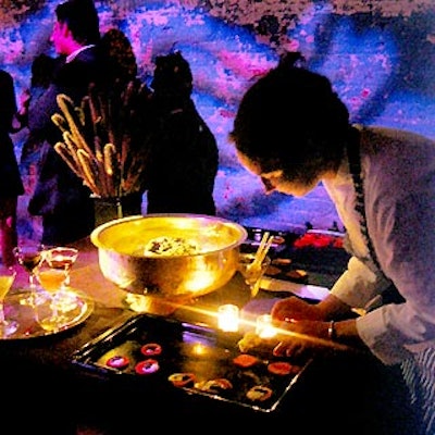 A caterwaiter served caviar to guests.