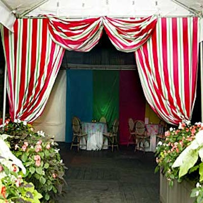 Musters & Company used fabrics from Lilly Pulitzer's spring 2004 collection in the decor, including this striped fuchsia curtain.