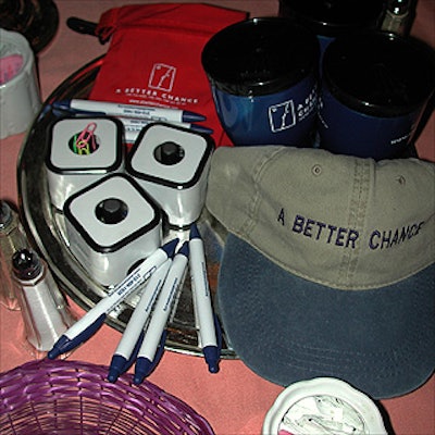 In lieu of a gift bag, A Better Chance placed logoed merchandise at the center of each table for guests to take.
