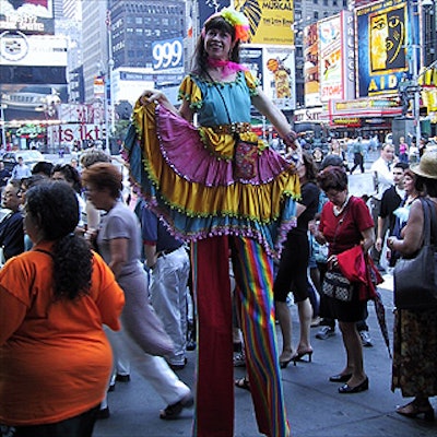 Stiltwalker Joanna Sherman helped draw the crowds from Times Square to the festival on West 46th Street.