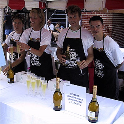 Volunteers manning a booth with champagne donated by Korbel included (from left to right) actor Markus Leonard, Karen Zornow of ad firm Serino Coyne, actor and Restaurant Associates waiter David-Michael Quirk, and theater columnist Forrest Mallard.