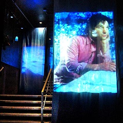 Projections of rippling waves morphed into photos from Entertainment Weekly in the entrance to the magazine's party at the Roxy. Inside, event designer Mark Musters used blue lighting and projections to spiff up the roller disco.