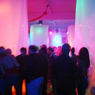 Sheer white columns of fabric and candy-colored lights filled Splashlight Studios for an event to promote the redesign of Finlandia's bottle.