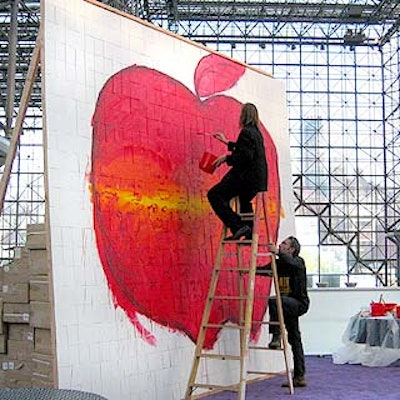 German artist Christof Breidenich painted two giant murals (one for each day of the show) on a wall of small wooden panels that were taken down and given to attendees at the end of each day.