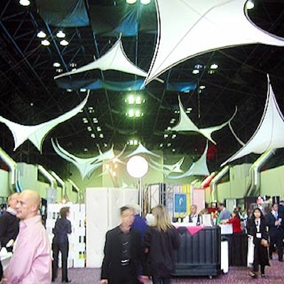 Transformit suspended fabric sculptures above the trade show floor.