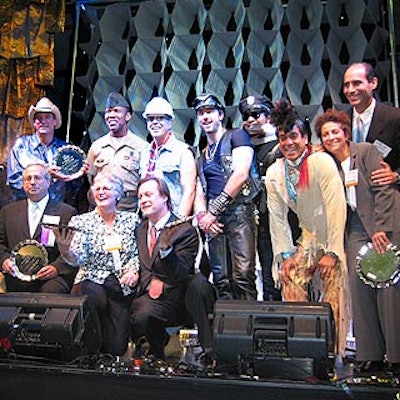 Joseph Cozza (front row left), Kathleen Moore, Patrick McMullan and Alison Awerbach and Jim Kirsch (far right) posed with the Village People at the BiZBash Event Industry Hall of Fame induction ceremony at the Javits Center.