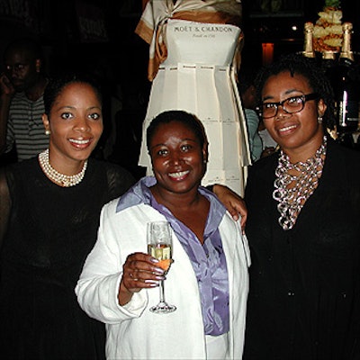 Posing with a dress made of Mo?t & Chandon bottle bags, the event's organizers (left to right): Marilyn Artis, an assistant producer from MTL Productions; Bernadette Weeks, president of Creative Solutions Plus, Mo?t's marketing agency; and Margo Lewis, principal of MTL Productions, the firm Weeks hired to produce the fashion show.