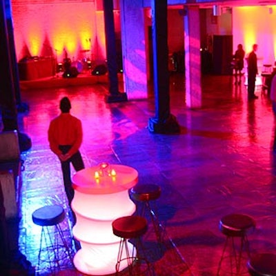 Bentley Meeker lit the lower level with red, blue and gold lights for the cocktail party and post-dinner after-party.
